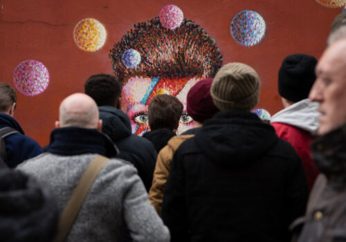 Crowd Admiring Colorful Street Art in Urban Public Space 134