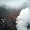 Steaming Volcanic Crater Amid Misty Mountain Surroundings 109