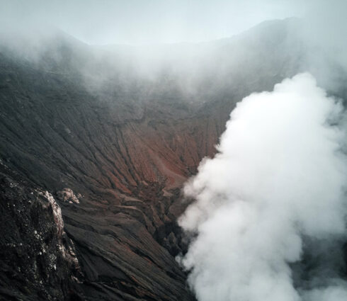 Steaming Volcanic Crater Amid Misty Mountain Surroundings 110
